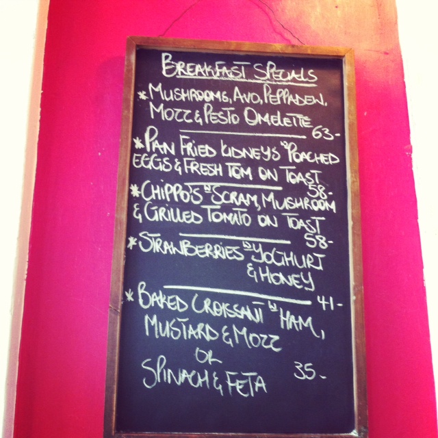 olympia cafe inside sign