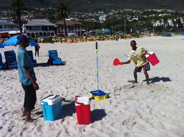Yesterday on Camps Bay beach two guys selling cold drinks decided to have a go on our swing ball set. I wish I could have recorded their giggling and the things they were saying to one another (Djy speel kak! Slaan hom! Slaan hon!). One of those lost-in-translation moments.